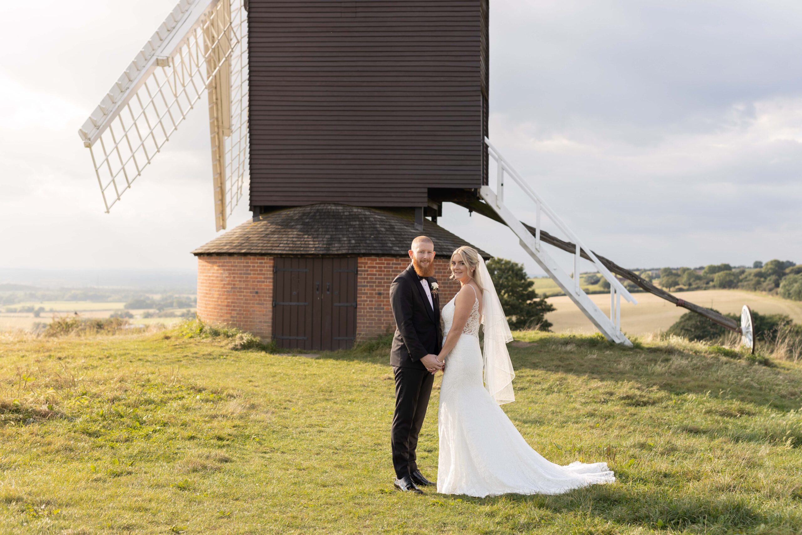 Bride and groom infront of windmill