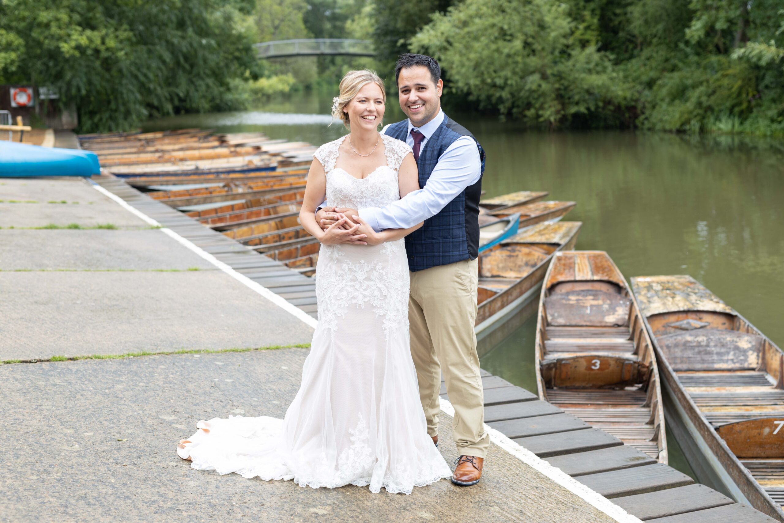 Bride and groom at boathouse